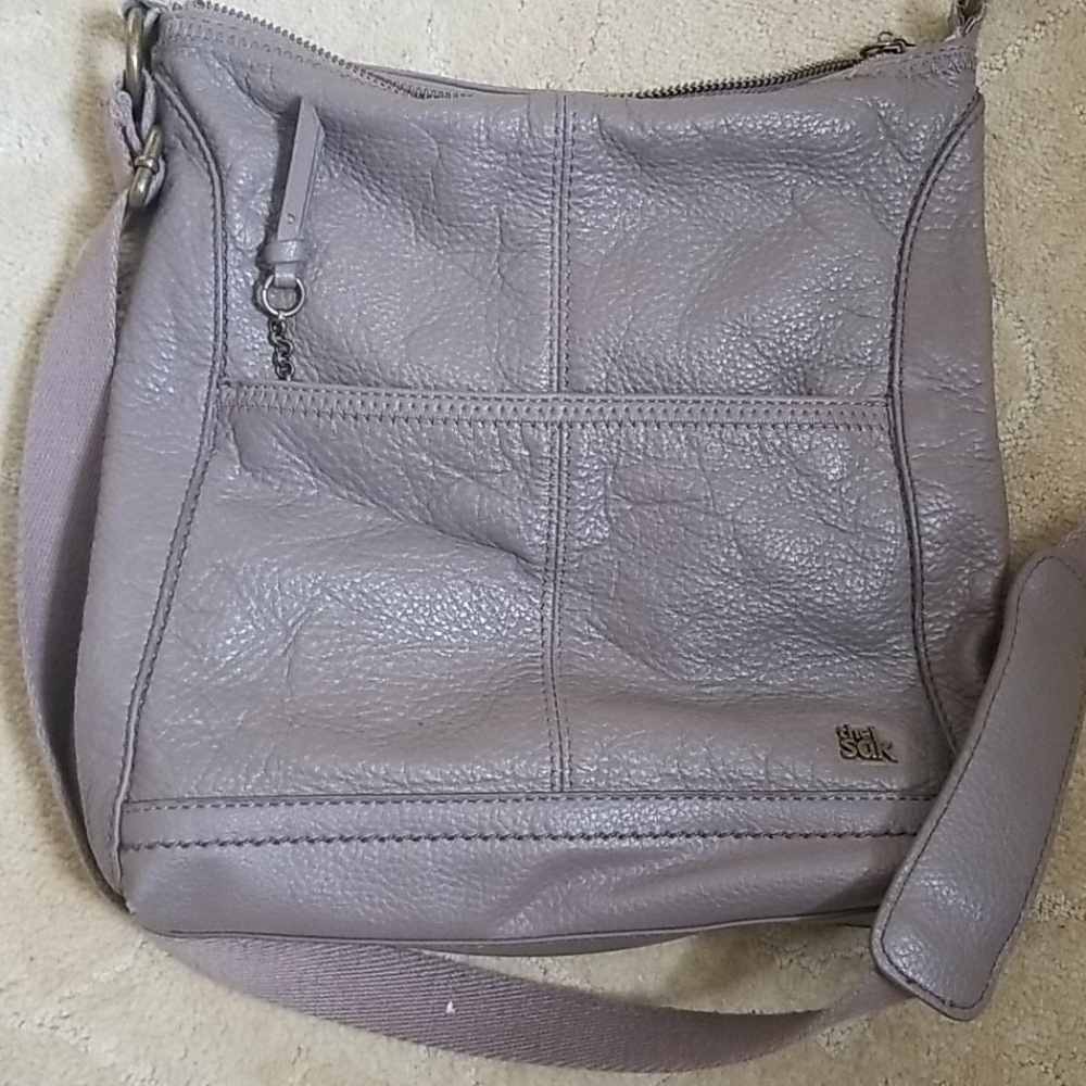 The Sak taupe colored crossbody